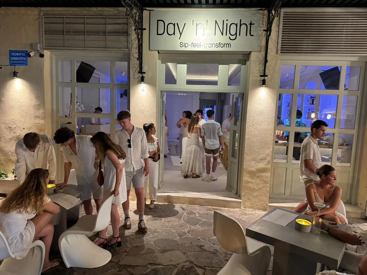 Friends seated at Day ’n’ Night on the Poros waterfront