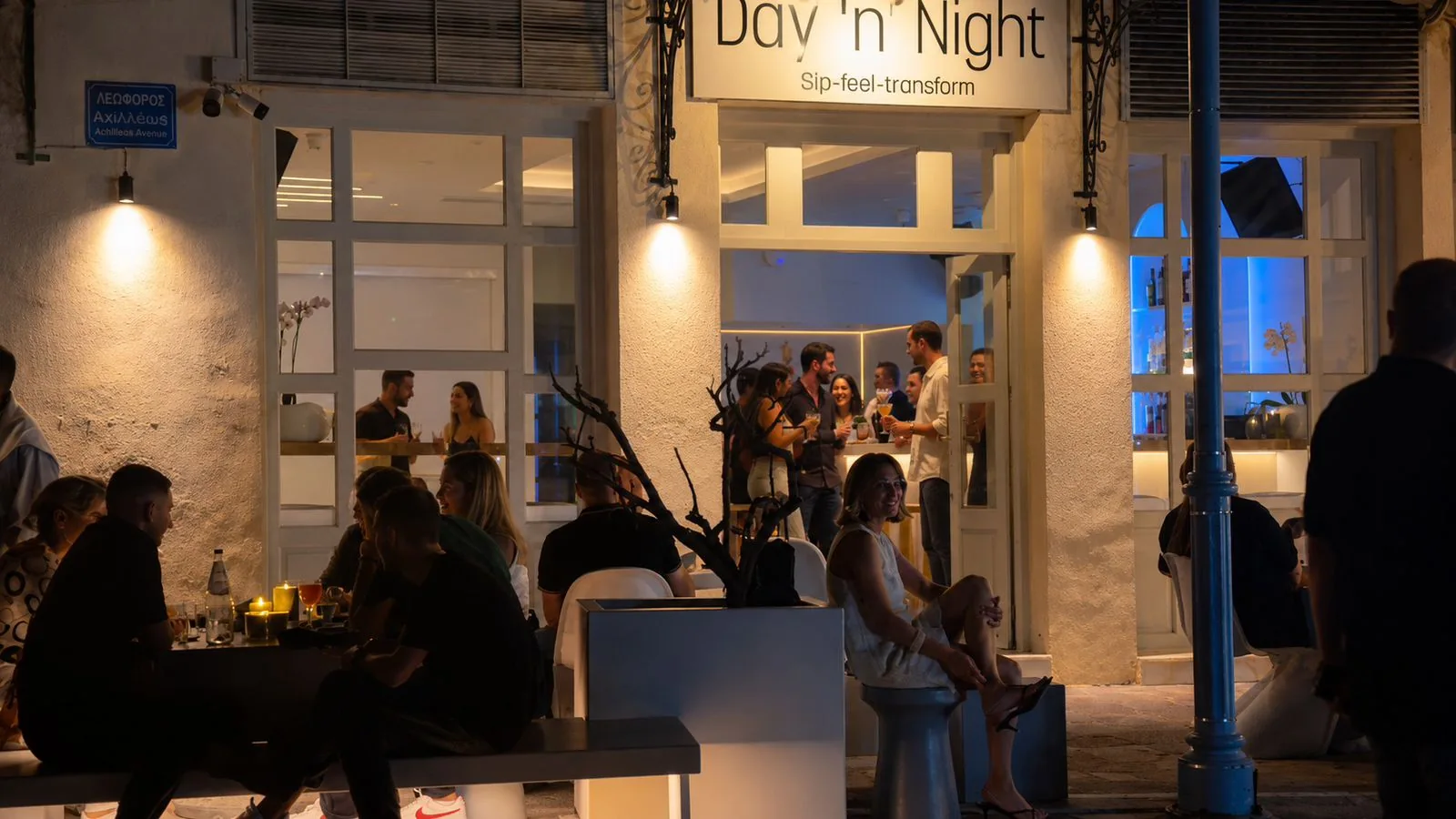 Day ’n’ Night cocktail bar illuminated on the Poros waterfront after sunset